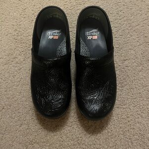 Dansko Black Slip-On Clogs with Textured Soles